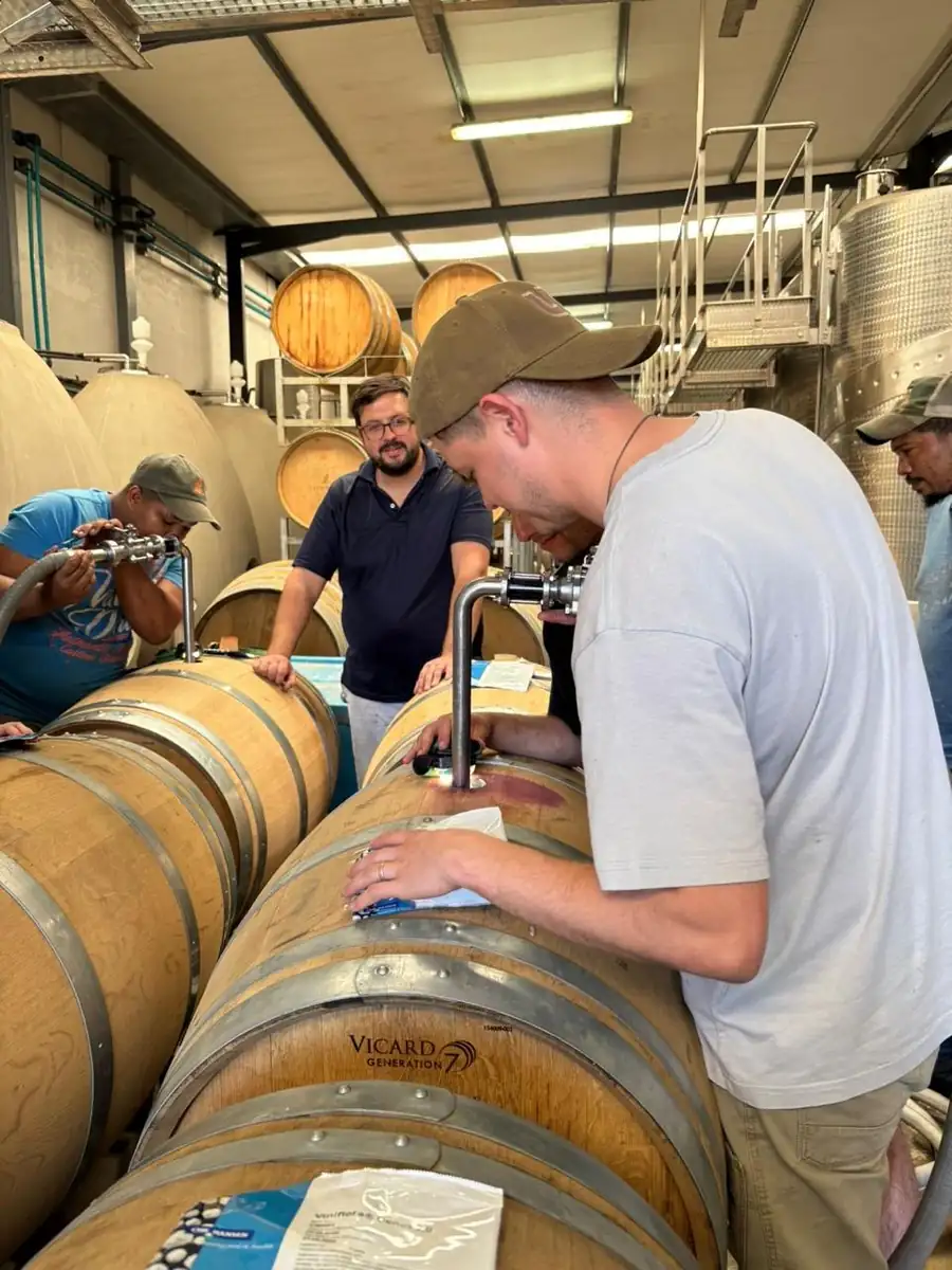 Working on a barrel with a bung and hose