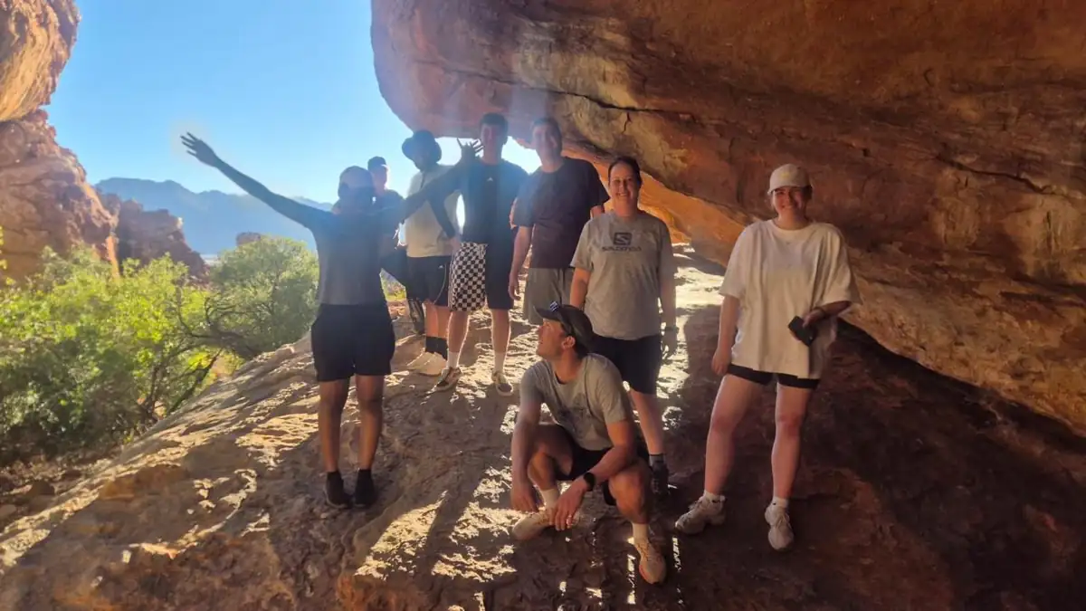 The group under a sandstone overhang